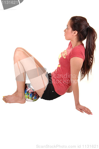 Image of Girl sitting on ball.