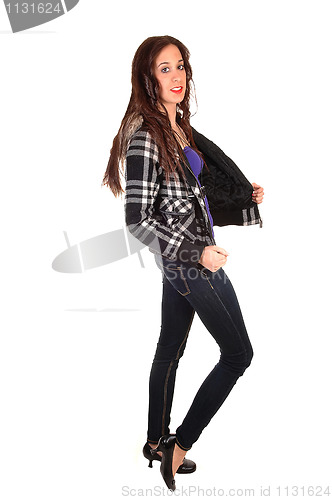 Image of Girl in jeans standing.