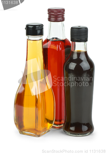 Image of Bottles with apple and red wine vinegar and soy sauce