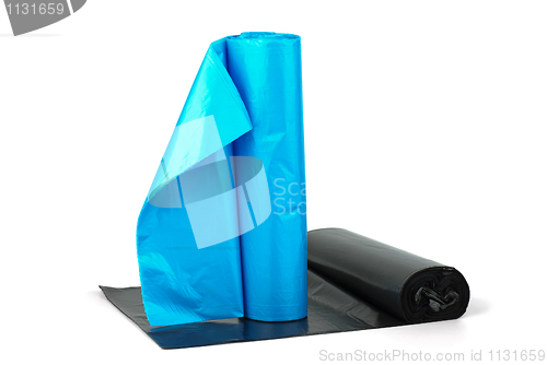 Image of Rolls of blue and  black plastic garbage bags