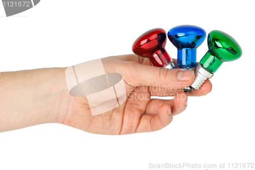 Image of Hand hold tiny red, blue and green spot tungsten lightbulbs