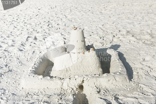 Image of Sand castle on a sunny beach