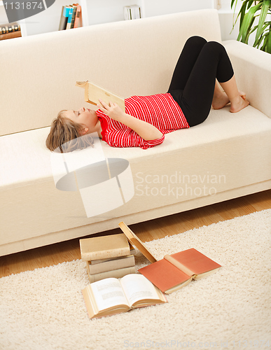 Image of Teenager reading books