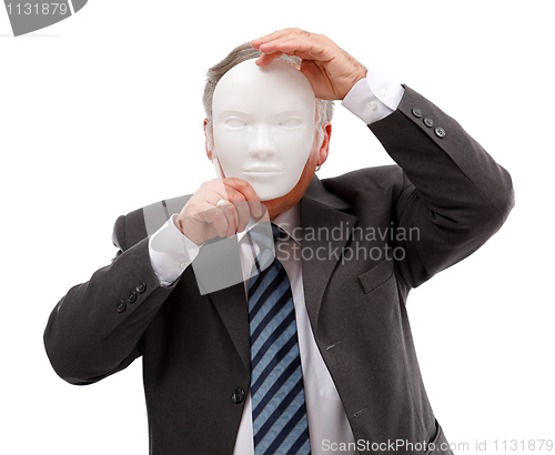 Image of Man covering his face with mask