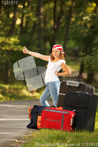 Image of Young hitch-hiker girl