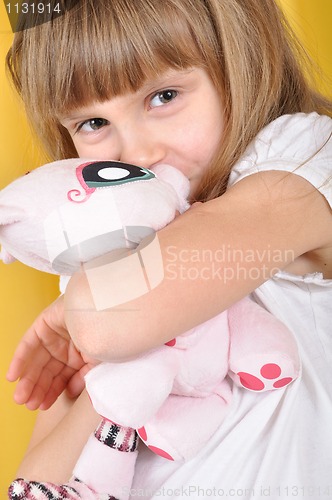 Image of child with a toy cat