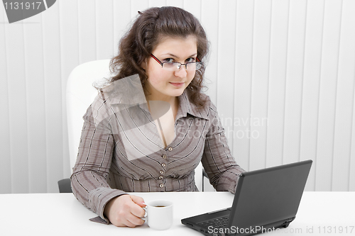 Image of The young business woman at office