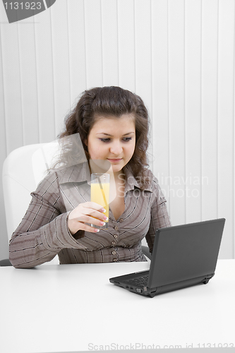 Image of The young business woman at office