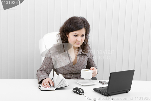 Image of The young business woman at office
