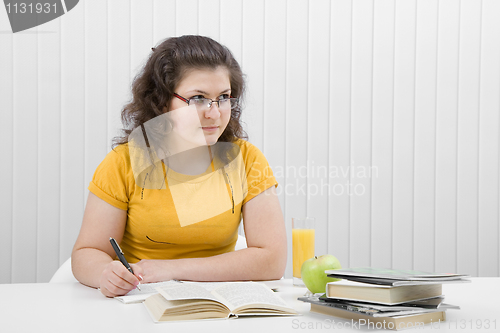 Image of The girl the student with writing-books and books