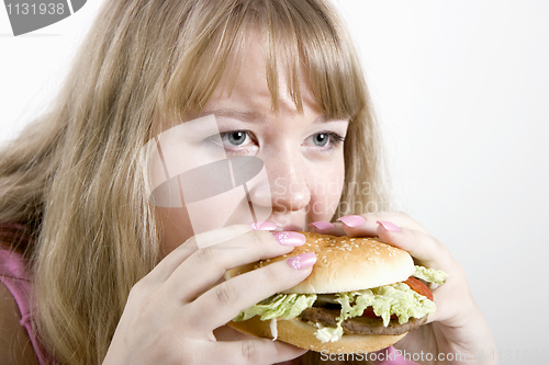 Image of The young woman and hamburger