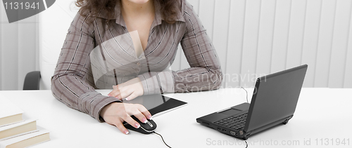 Image of The young business woman at office