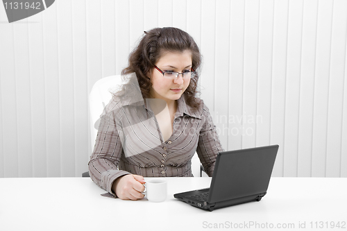 Image of The young business woman at office
