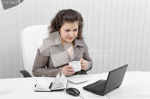 Image of The young business woman at office