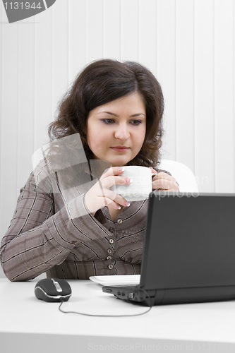 Image of The business woman drinks coffee