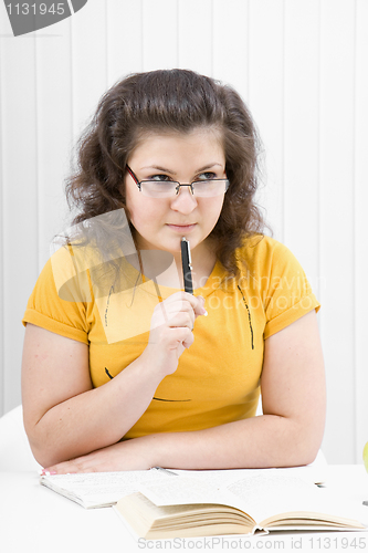Image of The girl the student with writing-books and books