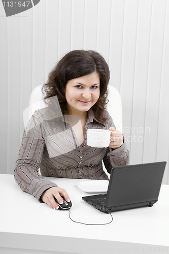 Image of The young business woman at office