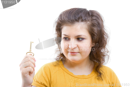 Image of key in the hands of a young woman