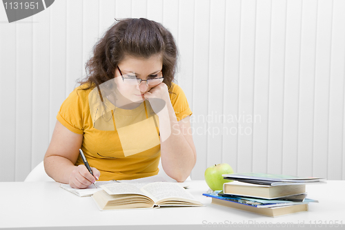 Image of The girl the student with writing-books and books