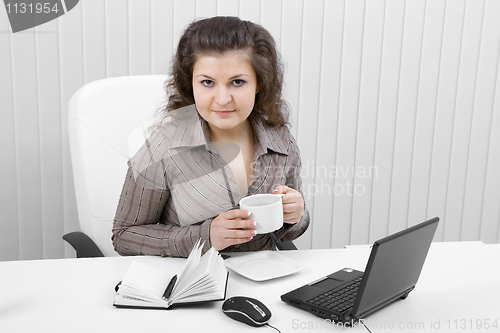 Image of The young business woman at office