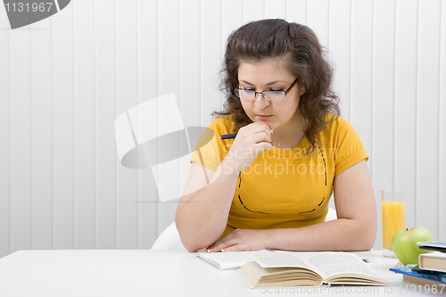 Image of The girl the student with writing-books and books