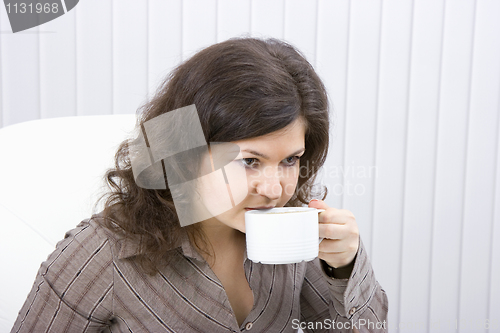 Image of The business woman drinks coffee