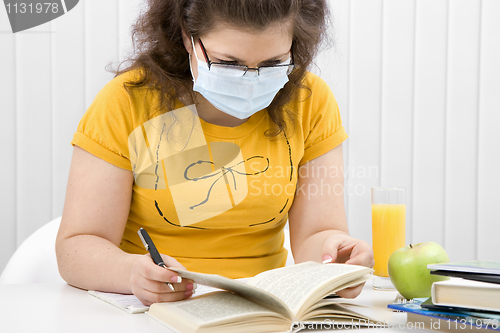 Image of girl student in a medical mask