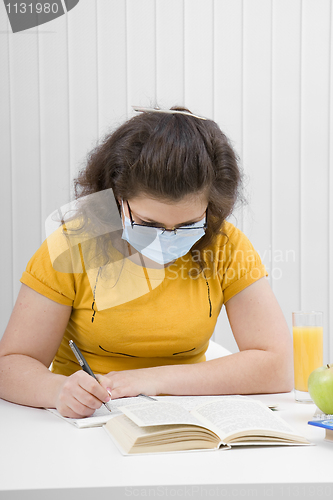 Image of girl student in a medical mask