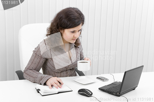 Image of The young business woman at office