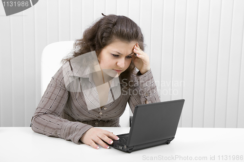 Image of The young woman with the laptop