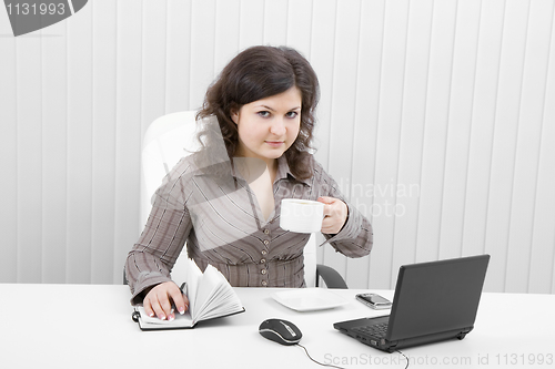 Image of The young business woman at office