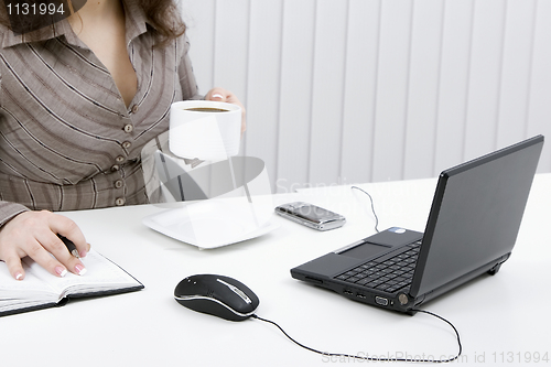 Image of The young business woman at office