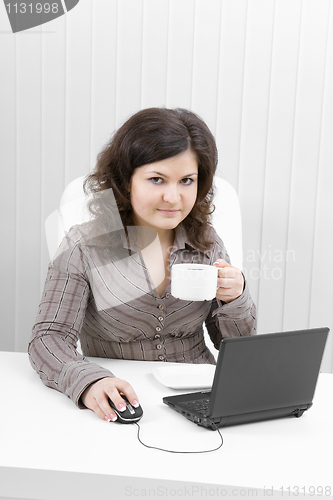 Image of The young business woman at office