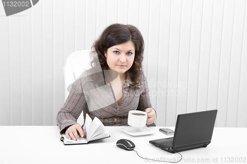 Image of The young business woman at office