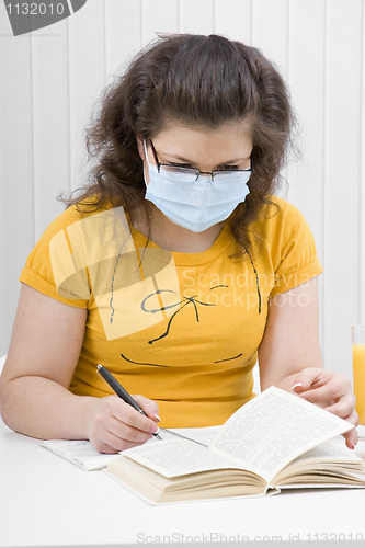 Image of girl student in a medical mask