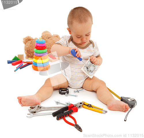 Image of Little boy with tools