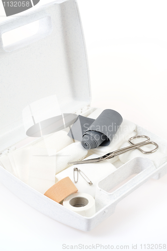 Image of Open first aid kit isolated on white background