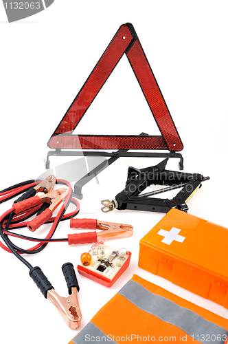 Image of Emergency kit for car - first aid kit, car jack, jumper cables, warning triangle, light bulb kit