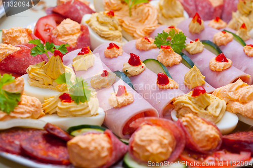 Image of Traditional food made out of ham eggs and paste with vegetable