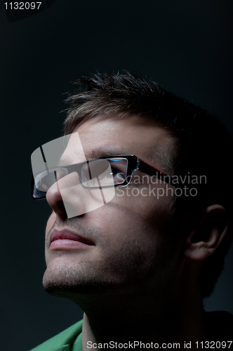 Image of Young student looking into the light wearing glasses