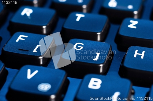 Image of Blue buttons of a keyboard from a computer