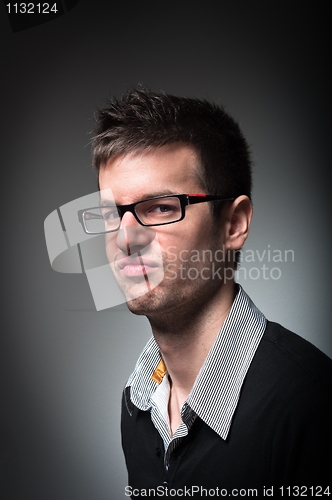 Image of Young university student with strange look on his face