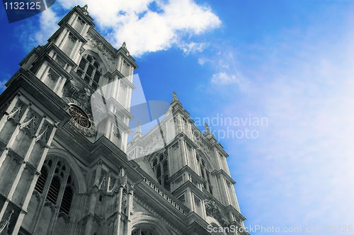 Image of Refurbished temple in sunlight against blue sky