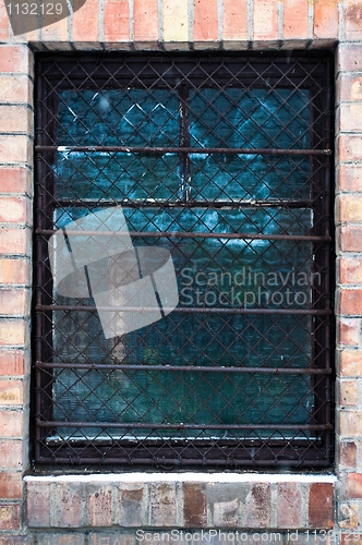 Image of Old window closeup with bars on it