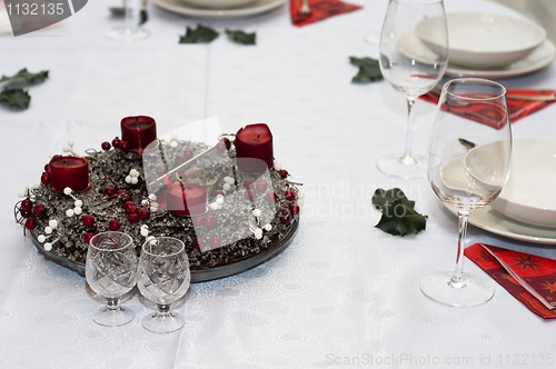 Image of Elegant christmas table with plates and glasses
