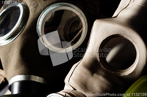 Image of Two gasmask with focus on the grey one