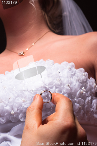 Image of groom proposing to her bride