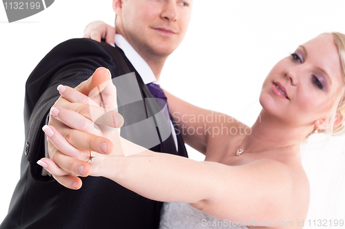 Image of Holding hand groom and bride enjoying dancing