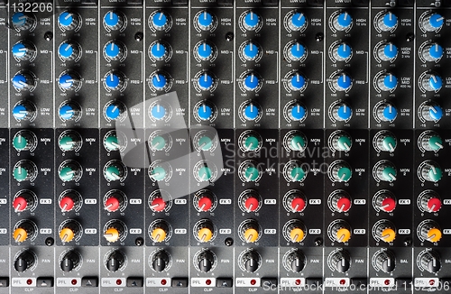 Image of Closeup of buttons of a studio mixer
