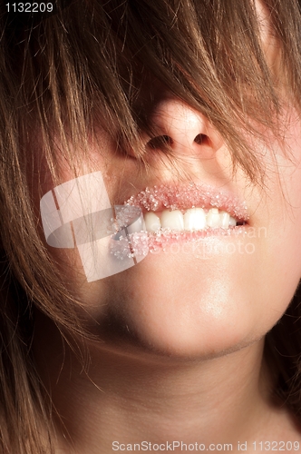 Image of Closeup of a girl with sugar on her lips